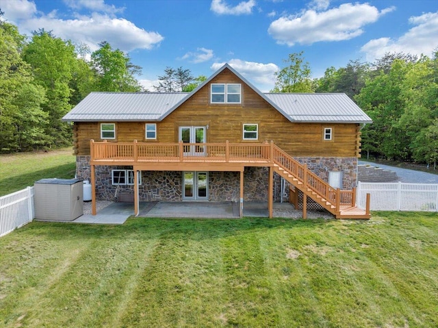 back of house featuring french doors, stone siding, a patio area, log exterior, and stairway