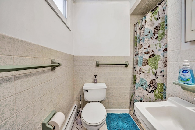 full bathroom with tile walls, baseboard heating, toilet, wainscoting, and a shower with shower curtain