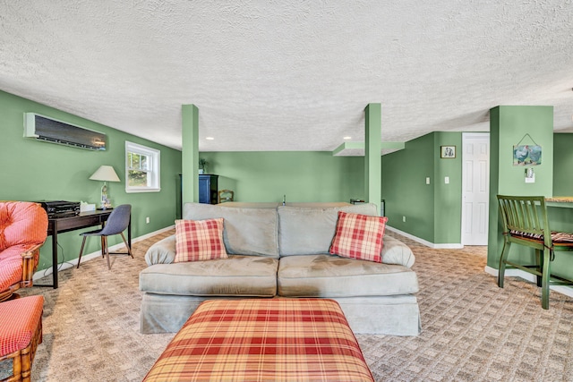 living area with a wall mounted AC, carpet floors, baseboards, and a textured ceiling