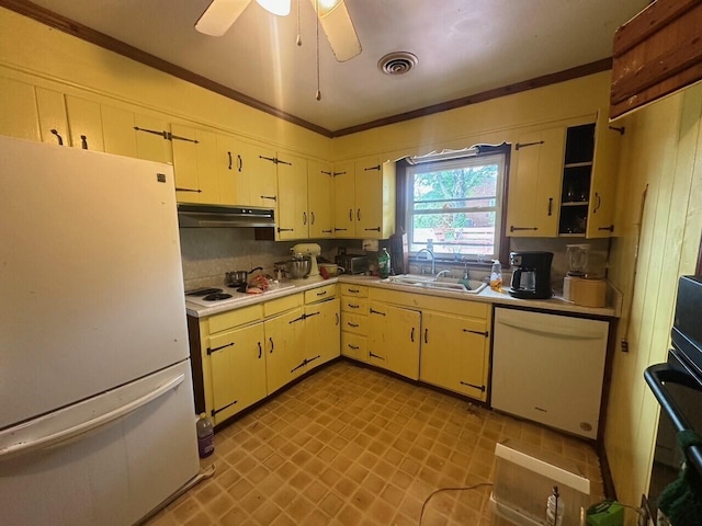 kitchen featuring white appliances, a sink, under cabinet range hood, light countertops, and a ceiling fan