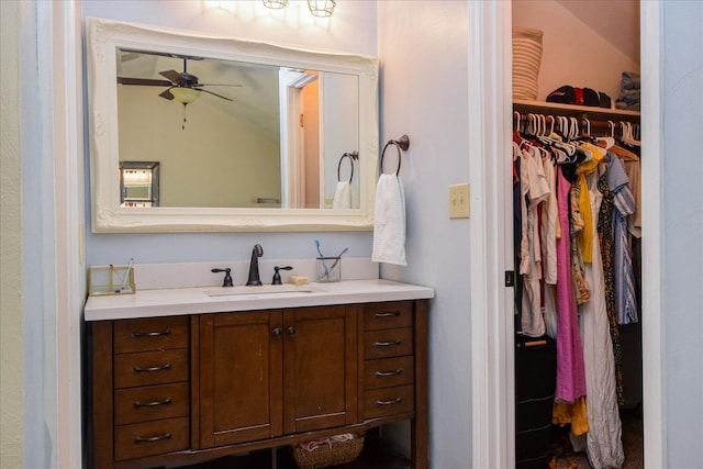 3279 Forest Ridge Rd, Roanoke, VA 24018 - bathroom with vanity, a ceiling fan, and a walk in closet