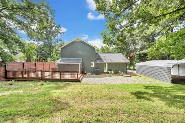 back of house with a deck, central AC unit, and roof with shingles