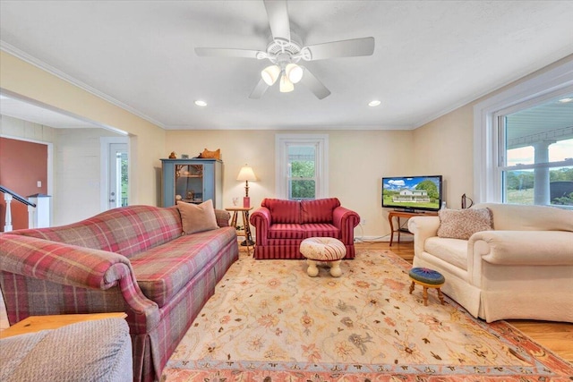 living area with wood finished floors, crown molding, recessed lighting, and a ceiling fan