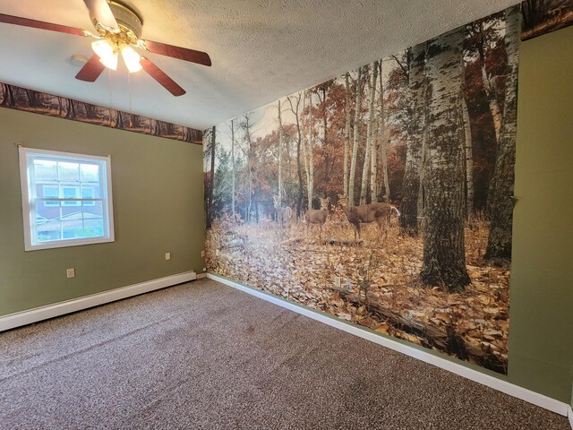 spare room with a baseboard radiator, carpet, ceiling fan, baseboards, and a textured ceiling