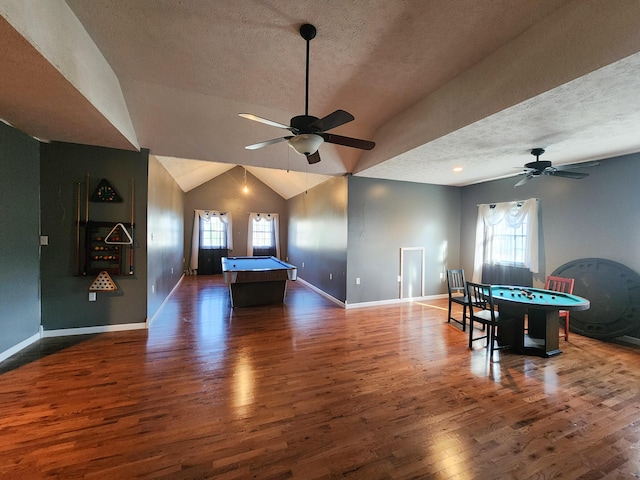 rec room featuring a ceiling fan, pool table, a textured ceiling, plenty of natural light, and dark wood-style flooring