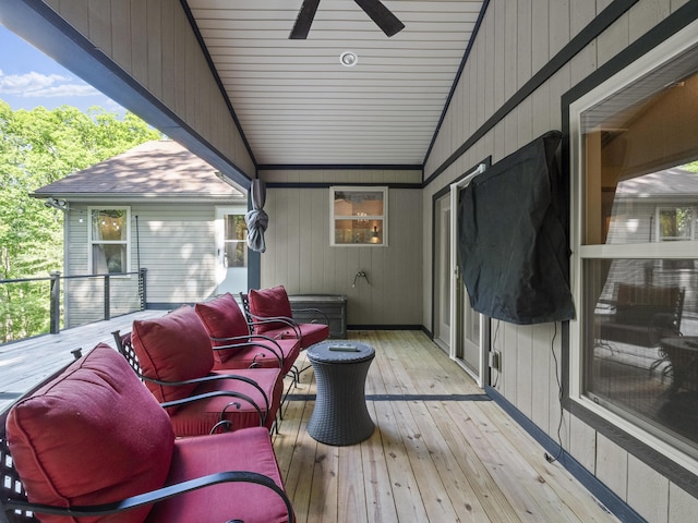wooden terrace with a ceiling fan