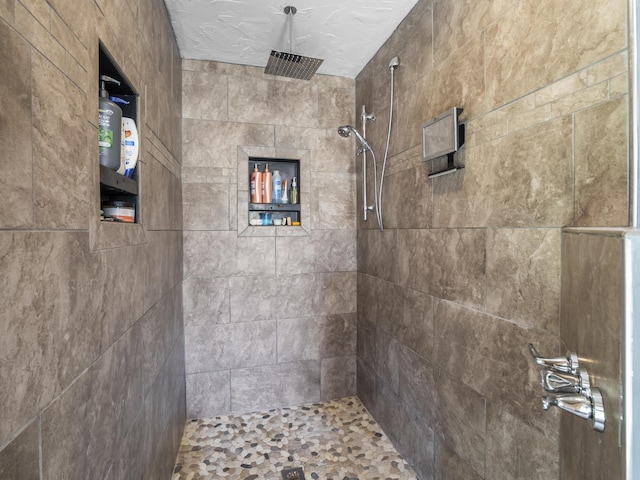 full bathroom with a tile shower