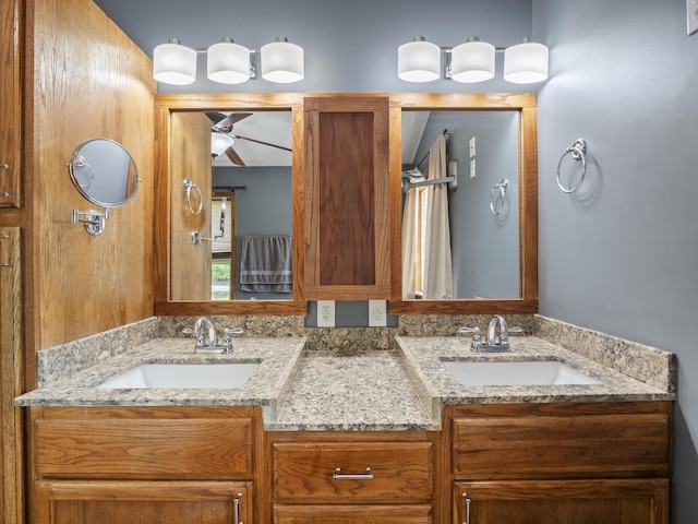 full bathroom featuring ceiling fan and double vanity