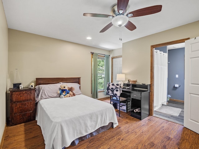 bedroom featuring wood finished floors, recessed lighting, ceiling fan, and baseboards