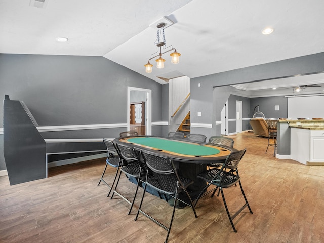 game room with light wood-type flooring, vaulted ceiling, recessed lighting, and baseboards