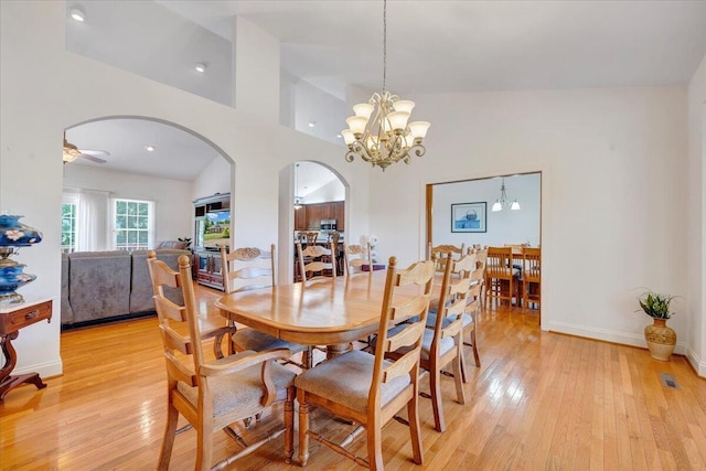 23 Alean Rd, Rocky Mount, VA 24151 - dining area with arched walkways, light wood-style flooring, a chandelier, ceiling fan, and lofted ceiling
