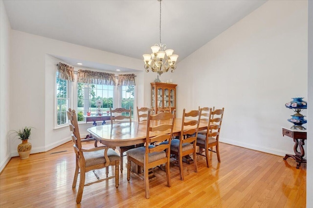 23 Alean Rd, Rocky Mount, VA 24151 - dining space with light wood finished floors, a chandelier, baseboards, and lofted ceiling