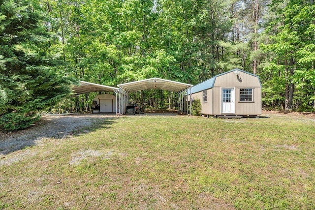 23 Alean Rd, Rocky Mount, VA 24151 - view of grassy yard with a shed, an outdoor structure, a detached carport, and driveway