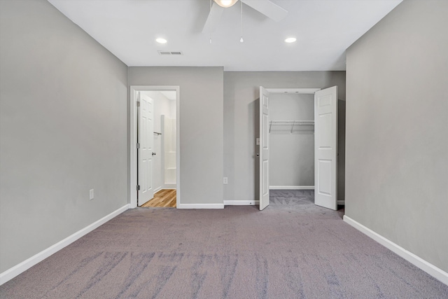unfurnished bedroom with carpet flooring, baseboards, a closet, a ceiling fan, and recessed lighting