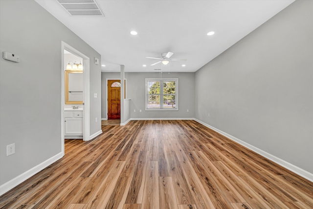 unfurnished living room featuring ceiling fan, recessed lighting, light wood-type flooring, and baseboards