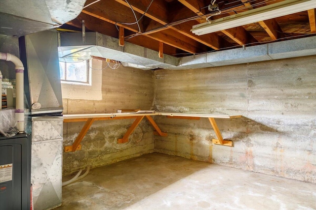 below grade area featuring heating unit