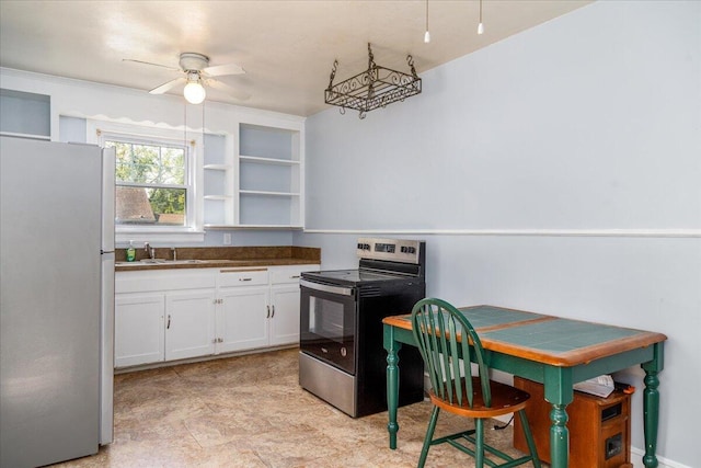 kitchen featuring stainless steel appliances, a ceiling fan, a sink, white cabinets, and open shelves