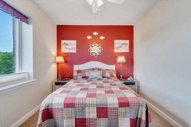 1217 Graves Harbor Trl Unit 119, Huddleston, VA 24104 - bedroom with carpet flooring, baseboards, an accent wall, and a ceiling fan