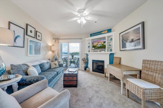 1217 Graves Harbor Trl Unit 119, Huddleston, VA 24104 - carpeted living area featuring ceiling fan and a fireplace with flush hearth