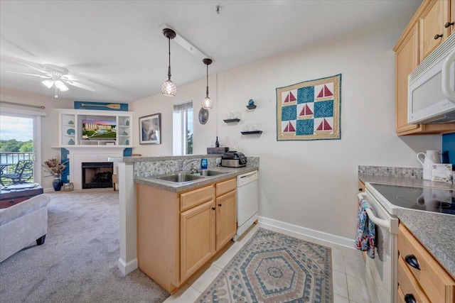 1217 Graves Harbor Trl Unit 119, Huddleston, VA 24104 - kitchen featuring white appliances, a sink, light brown cabinets, open floor plan, and a peninsula