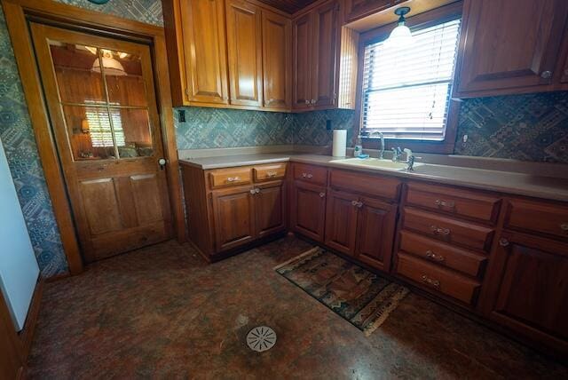 336 Turkey Run Ln, Rural Retreat, VA 24368 - kitchen with a sink, brown cabinetry, tasteful backsplash, wallpapered walls, and light countertops