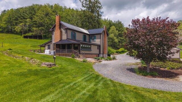 336 Turkey Run Ln, Rural Retreat, VA 24368 - victorian home with a chimney, a front lawn, a porch, metal roof, and gravel driveway