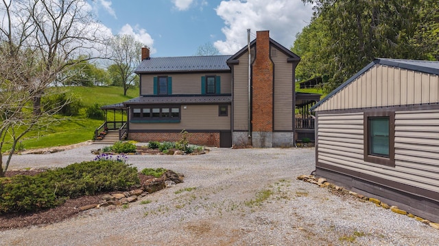 336 Turkey Run Ln, Rural Retreat, VA 24368 - view of front of home with a chimney, driveway, and metal roof