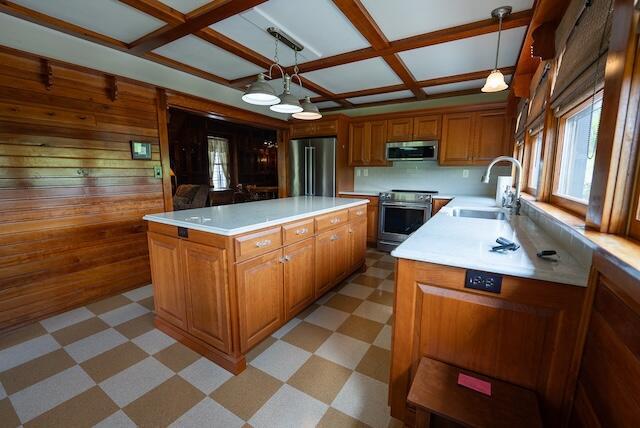 336 Turkey Run Ln, Rural Retreat, VA 24368 - kitchen with appliances with stainless steel finishes, a sink, light flooring, brown cabinetry, and coffered ceiling