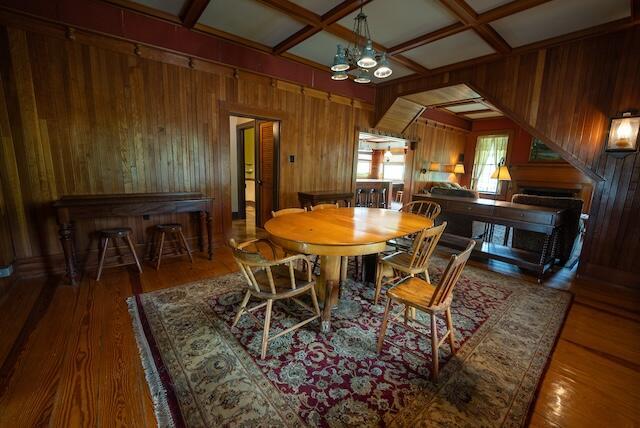 336 Turkey Run Ln, Rural Retreat, VA 24368 - dining area with wood walls, wood finished floors, coffered ceiling, a chandelier, and beamed ceiling