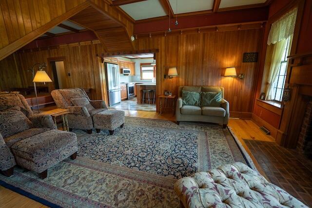 336 Turkey Run Ln, Rural Retreat, VA 24368 - living area featuring wooden walls, healthy amount of natural light, and light wood-style floors