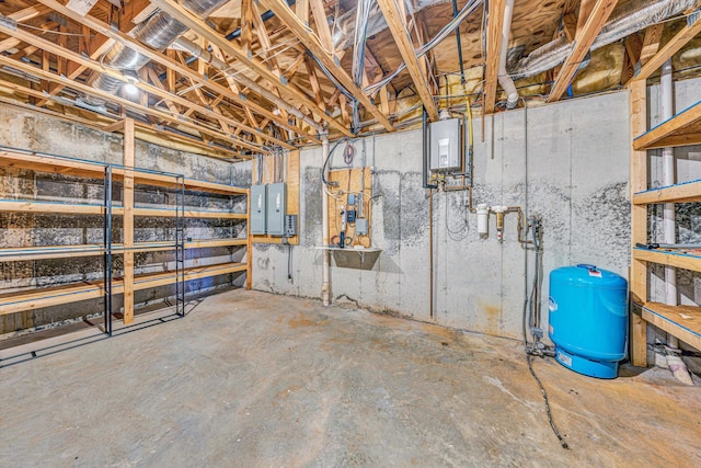 unfinished below grade area with a water pressure tank