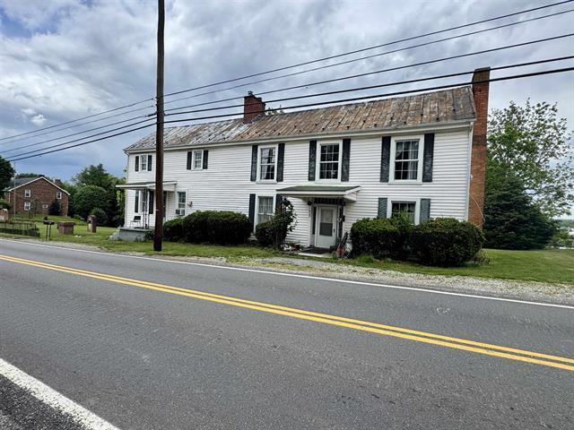 view of front of house with a chimney