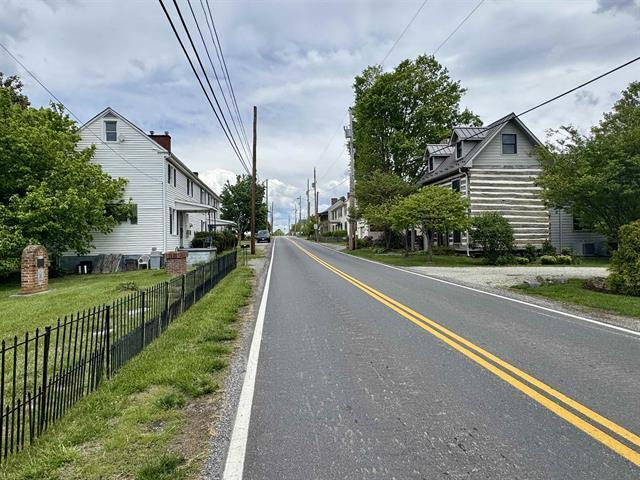 view of asphalt street with a residential view