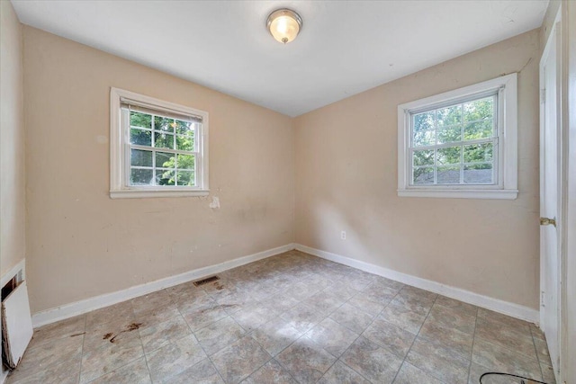 1919 Clinton Ave SE, Roanoke, VA 24013 - spare room featuring baseboards and radiator heating unit