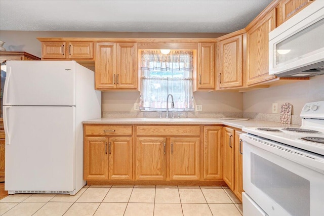 1921 Clinton Ave SE, Roanoke, VA 24013 - kitchen featuring white appliances, a sink, light countertops, and light tile patterned flooring