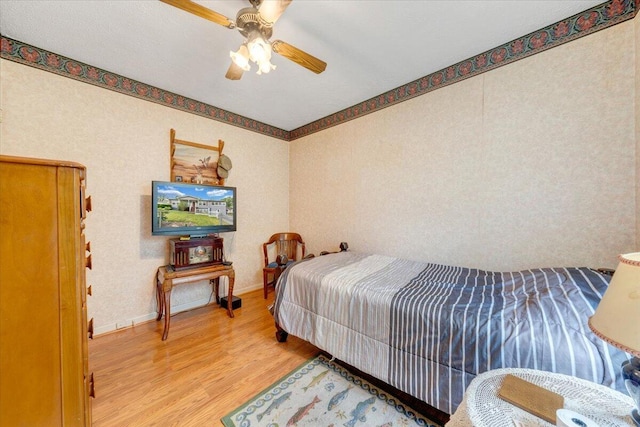 1921 Clinton Ave SE, Roanoke, VA 24013 - bedroom featuring light wood finished floors, ceiling fan, and baseboards