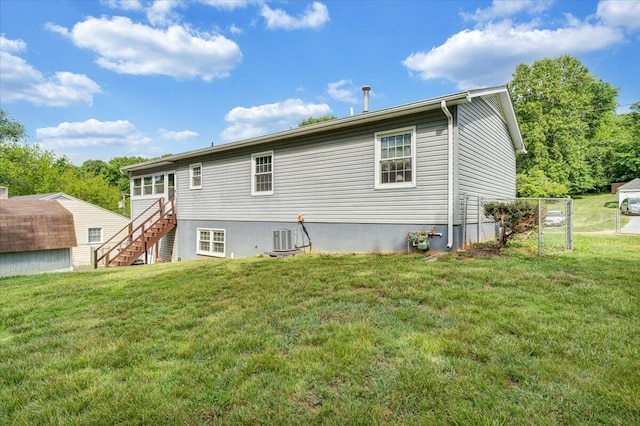 1921 Clinton Ave SE, Roanoke, VA 24013 - rear view of house with stairway, a yard, and central AC unit