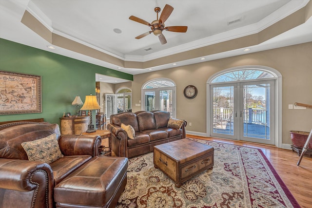 73 Windmere Trl, Moneta, VA 24121 - living area with french doors, a raised ceiling, crown molding, recessed lighting, and wood finished floors