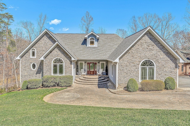 73 Windmere Trl, Moneta, VA 24121 - view of front of house with stone siding, a front yard, covered porch, and roof with shingles