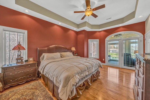73 Windmere Trl, Moneta, VA 24121 - bedroom featuring access to outside, a raised ceiling, light wood-style flooring, baseboards, and recessed lighting