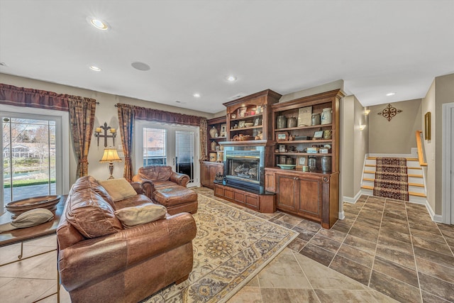 73 Windmere Trl, Moneta, VA 24121 - living room with stairs, a fireplace with raised hearth, recessed lighting, and baseboards