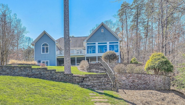 73 Windmere Trl, Moneta, VA 24121 - rear view of house featuring a yard and a sunroom