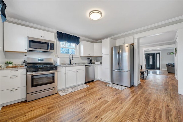380 Trails End Dr, Hardy, VA 24101 - kitchen featuring appliances with stainless steel finishes, a sink, white cabinetry, light wood-style flooring, and ornamental molding