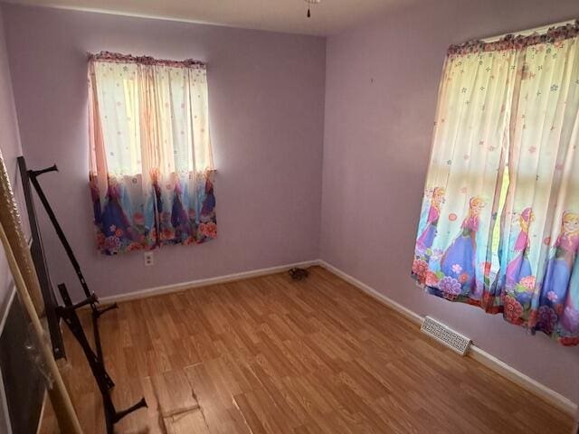 1433 Morehead Ave SE, Roanoke, VA 24013 - unfurnished room with wood finished floors and baseboards