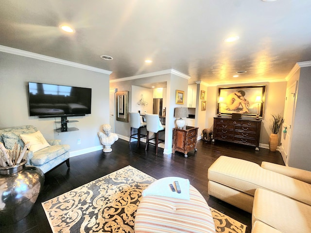 living room featuring baseboards, crown molding, recessed lighting, and wood finished floors