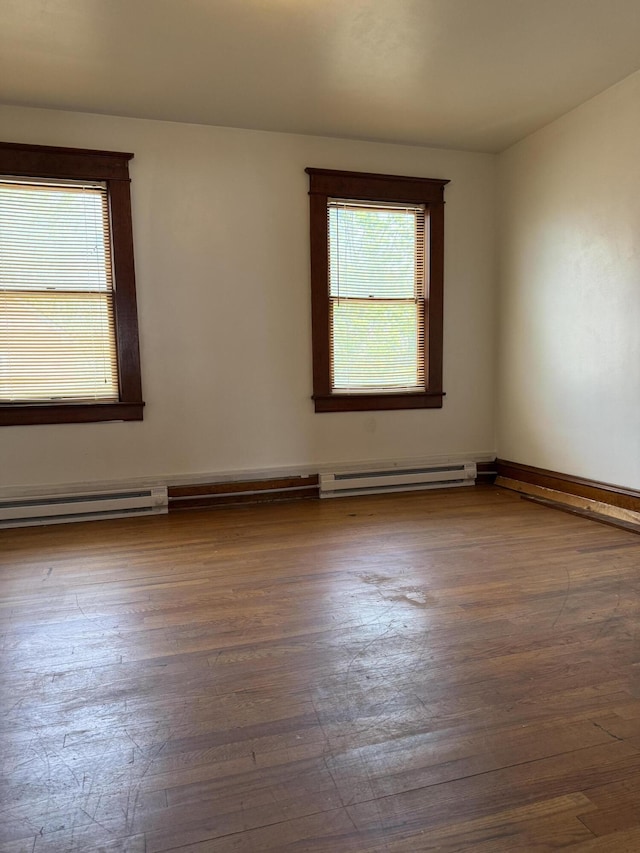 111 Rosedale Ave, Covington, VA 24426 - spare room featuring wood finished floors and baseboard heating