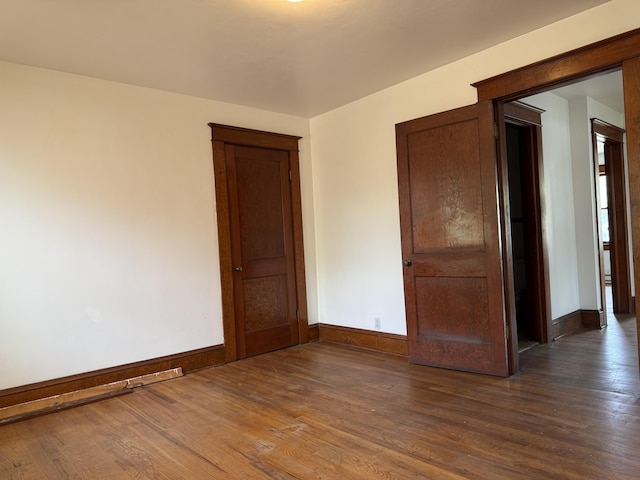 111 Rosedale Ave, Covington, VA 24426 - spare room with baseboards and dark wood-style floors