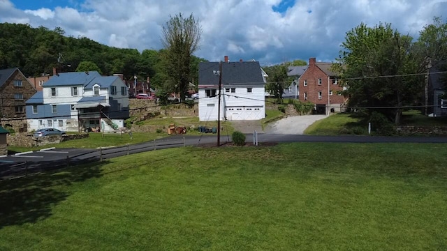 111 Rosedale Ave, Covington, VA 24426 - view of yard featuring driveway, a residential view, and an attached garage