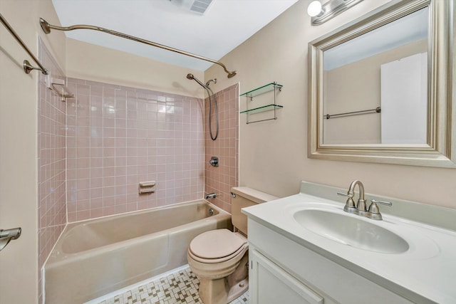 bathroom featuring toilet, vanity, and shower / washtub combination