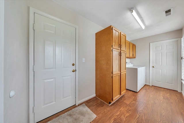 2420 Carlsbad Cir, Roanoke, VA 24012 - washroom featuring cabinet space, light wood-style flooring, and baseboards